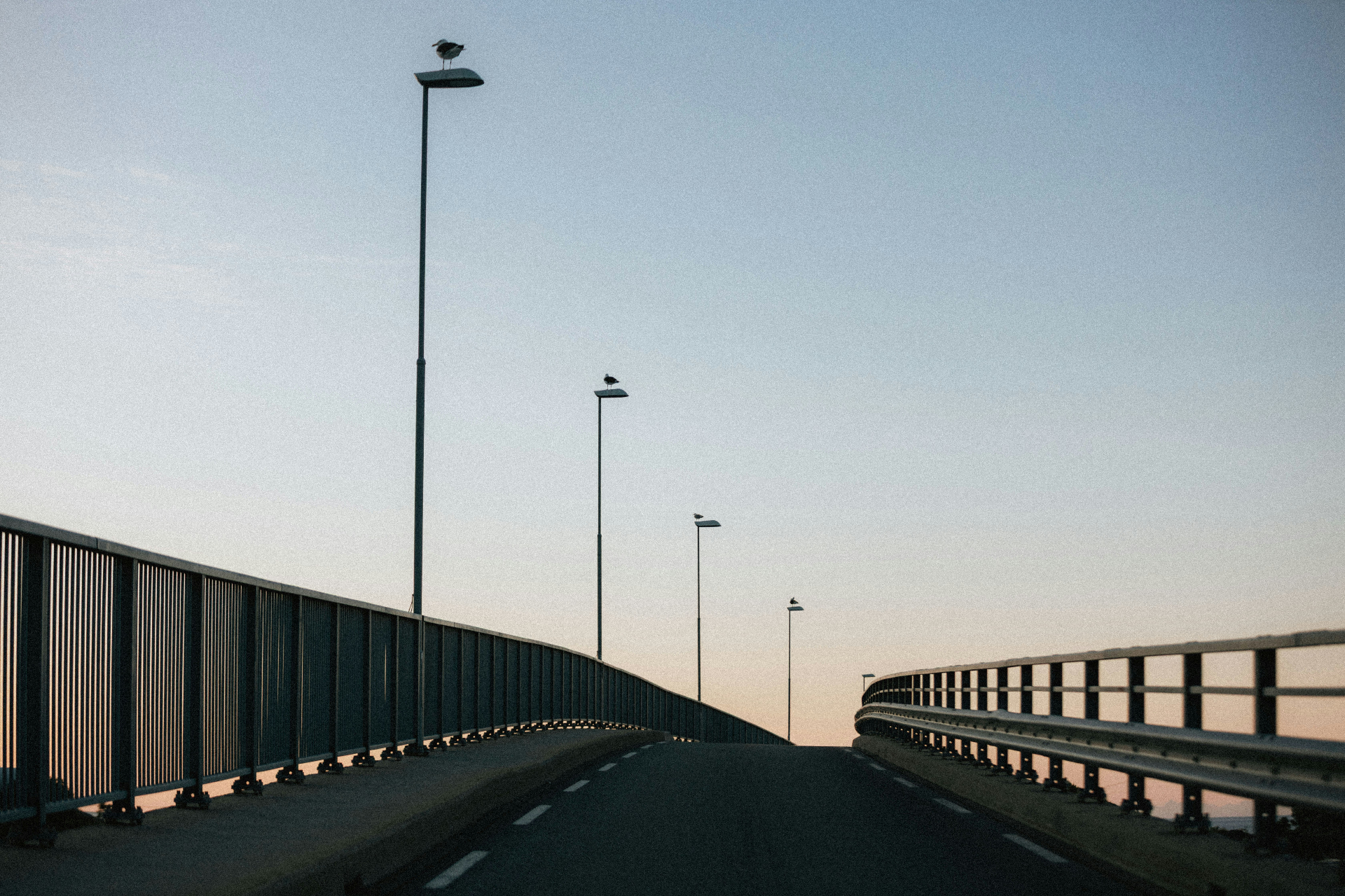 Bridge road stretching into the horizon at dusk
